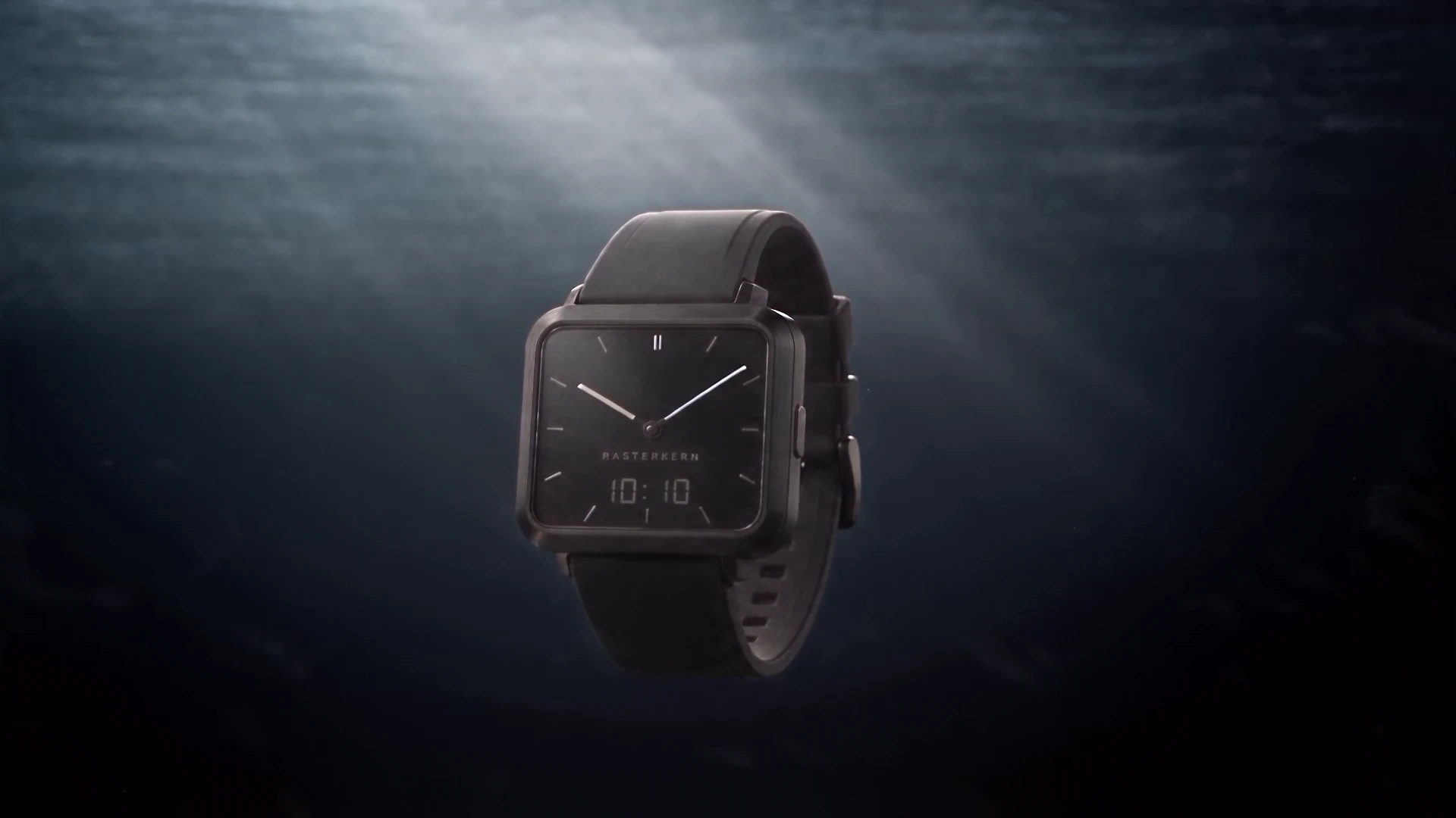 Die Uhr sinkt durch zunehmend dunkles Wasser in die mittlere Tiefe.